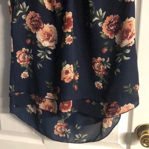 Dark blue with roses short sleeves some pilling on strings on round of blouse